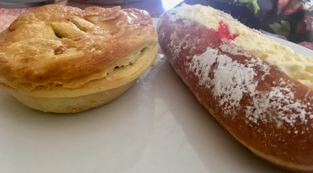 New Zealand delicacies - a steak and cheese pie, and a proper jam doughnut