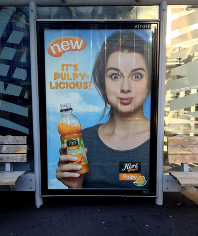 An Ad for Pulp Orange Juice in a bus stop