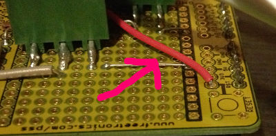 Photo of Arduino showing a wire soldered to the reset pin